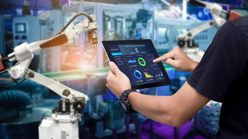 16x9 hands holding tablet blurred automation machine background SHS 1457193278.2400