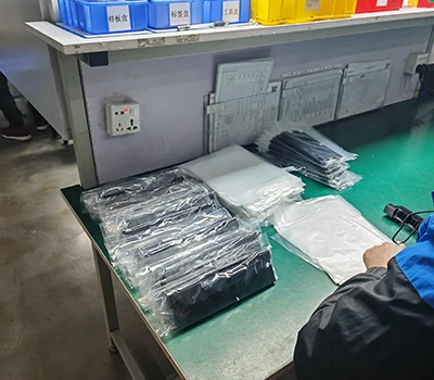 Workers packing aerospace parts