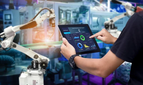 16x9 hands holding tablet blurred automation machine background SHS 1457193278.2400